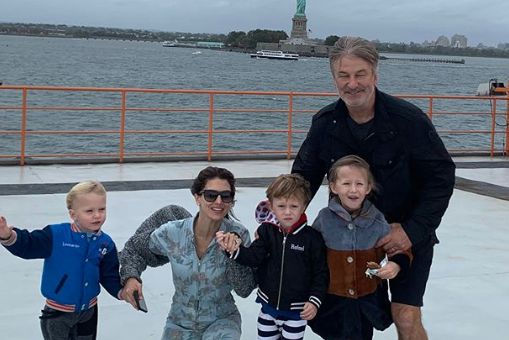 Baldwin and family NEAR the Statue of Liberty.
